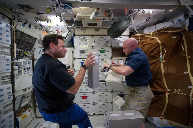 NASA image: View of STS-134 Crew Members working on the Middeck