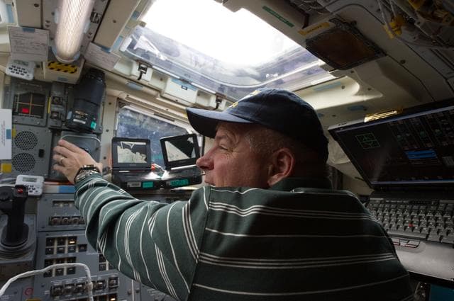 NASA image: View of STS-134 Pilot Johnson working on the Flight Deck