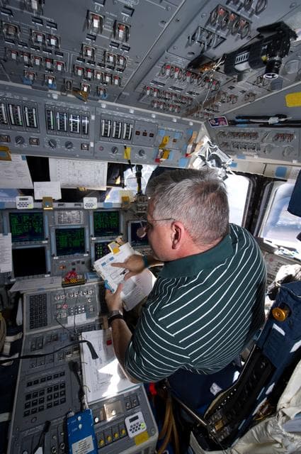 NASA image: View of STS-134 Pilot Johnson working on the Flight Deck