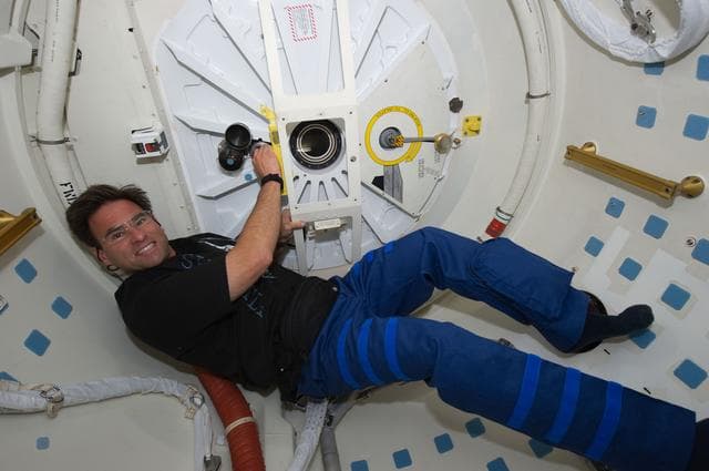 NASA image: View of MS Chamitoff posing for a photo on the Middeck