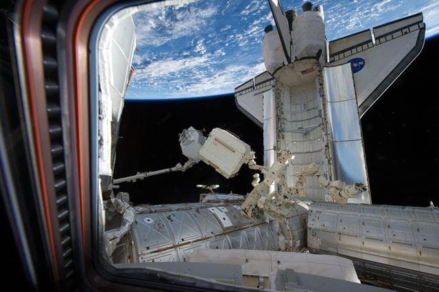 NASA image: View of Endeavour docked to the ISS and the AMS-2 during Transfer