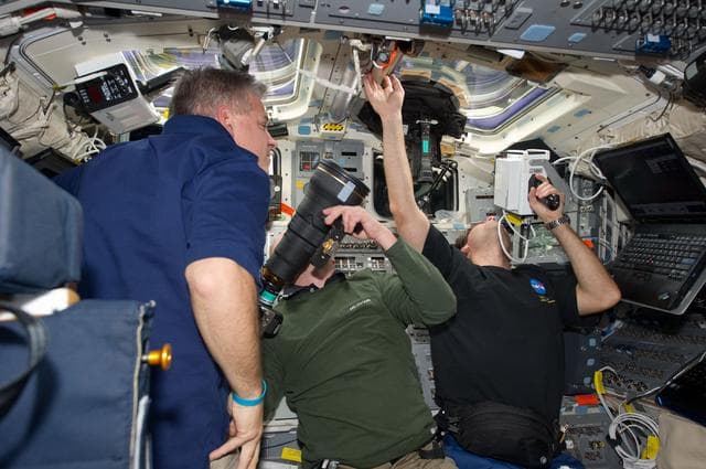 NASA image: STS-134 Crew Members working on the Flight Deck