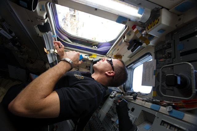 NASA image: View of STS-134 MS Feustel on the Flight Deck