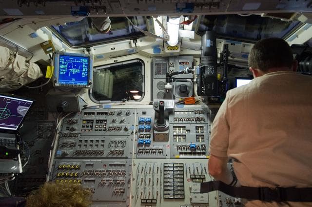 NASA image: Walheim on Atlantis Aft Flight Deck during Rendezvous OPS