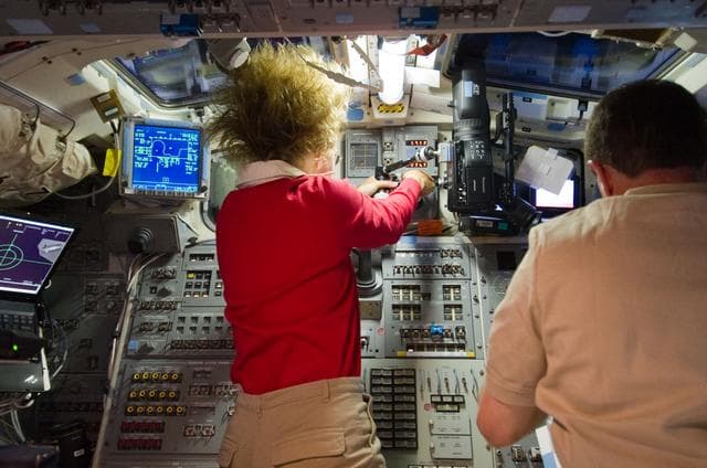 NASA image: Magnus and Walheim on Atlantis Aft Flight Deck during Rendezvous OPS