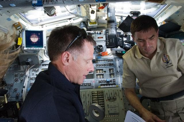 NASA image: Ferguson and Walheim on Atlantis Aft Flight Deck during Rendezvous OPS