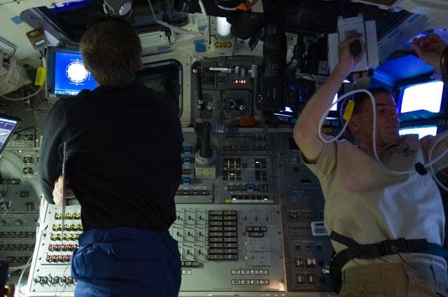 NASA image: Ferguson and Walheim on Atlantis Aft Flight Deck during Rendezvous OPS