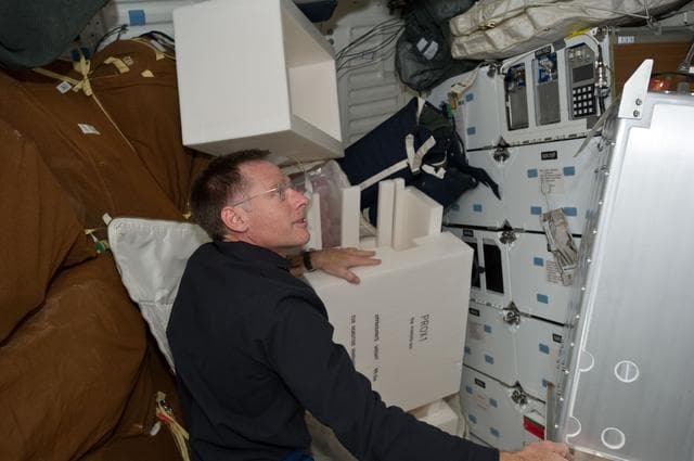 NASA image: Ferguson works with Stowage on Atlantis Middeck