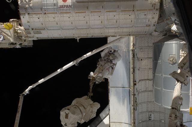 NASA image: Fossum conducts Photo OPS during EVA 1