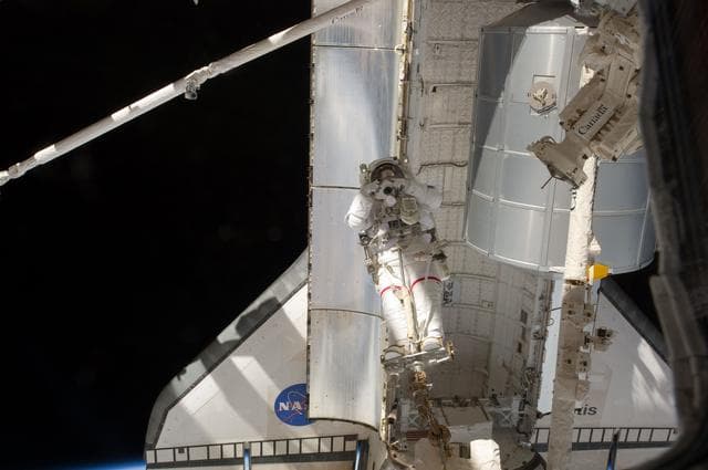 NASA image: Fossum conducts Photo OPS during EVA 1