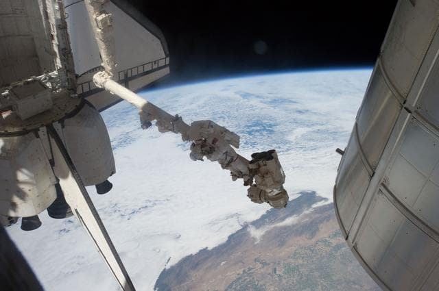 NASA image: Fossum conducts Photo OPS during EVA 1