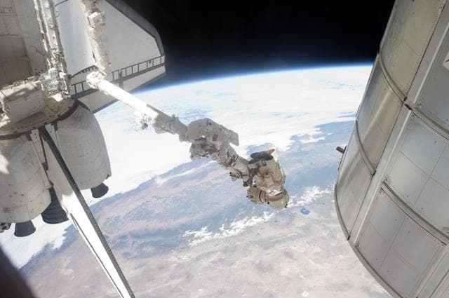 NASA image: Fossum conducts Photo OPS during EVA 1