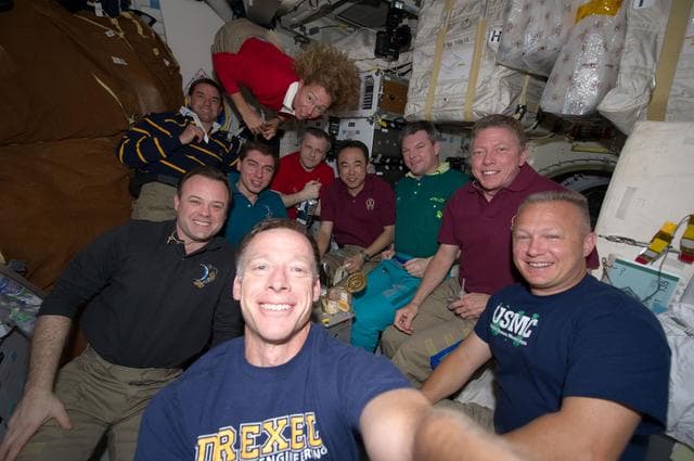 NASA image: Crewmembers share All-American Meal on Atlantis Middeck