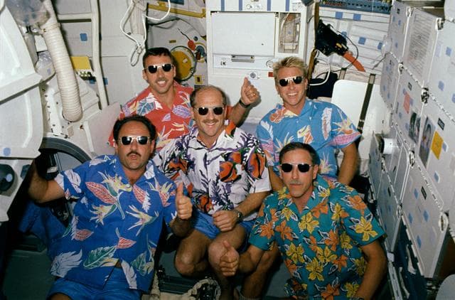 NASA image: STS-26 crewmembers in Hawaiian shirts and sunglasses pose for group portrait