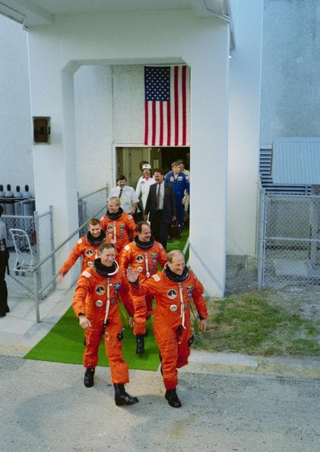 NASA image: STS-26 crewmembers leave KSC O&C Bldg on their way to the launch pad