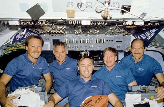 NASA image: STS-27 crew poses for inflight portrait on forward flight deck with football
