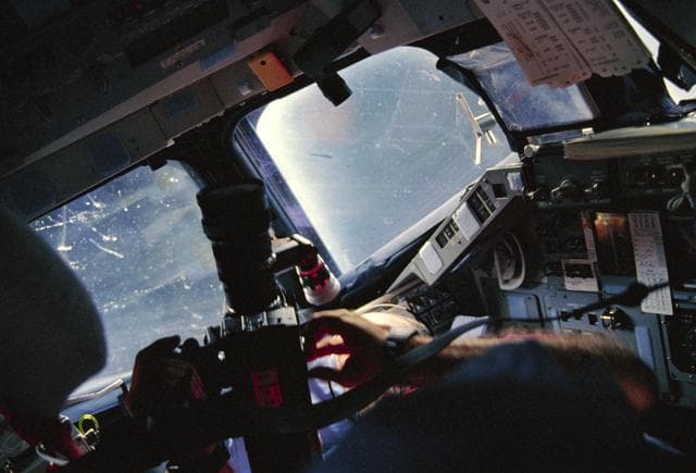 NASA image: STS-29 Discovery, OV-103, MS Bagian uses video camera on forward flight deck