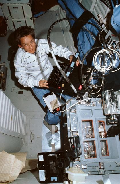 NASA image: STS-30 MS Cleave monitors fluids experiment apparatus (FEA) equipment