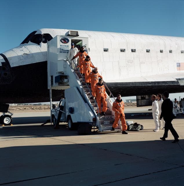 NASA image: STS-31 crew egresses Discovery, OV-103, via stairway after EAFB landing