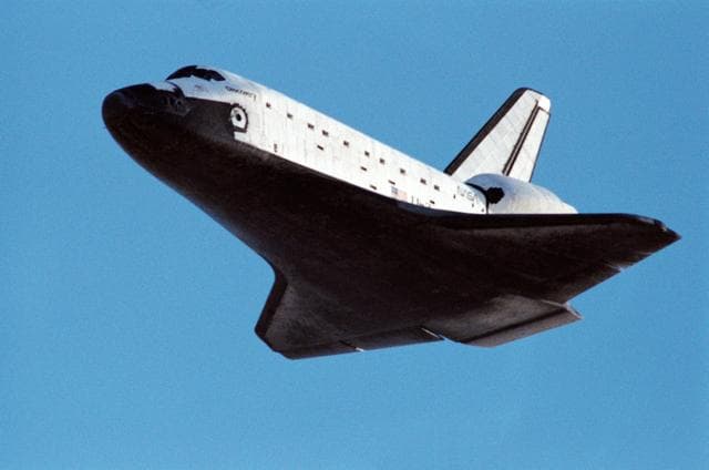 NASA image: STS-31 Discovery, Orbiter Vehicle (OV) 103, glides toward EAFB landing