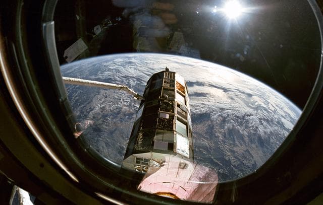 NASA image: LDEF grappled by remote manipulator system (RMS) during STS-32 retrieval