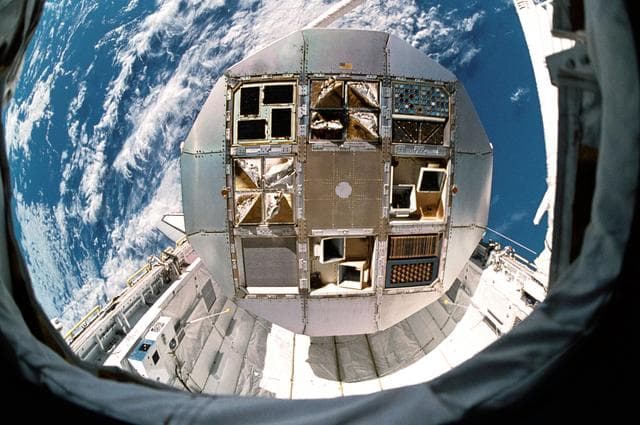NASA image: LDEF positioned by RMS over OV-102's payload during STS-32 retrieval