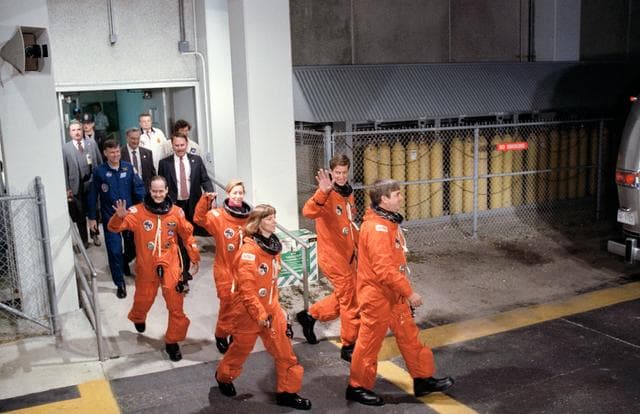 NASA image: STS-32 crewmembers wave as they leave KSC O&C Bldg for launch pad