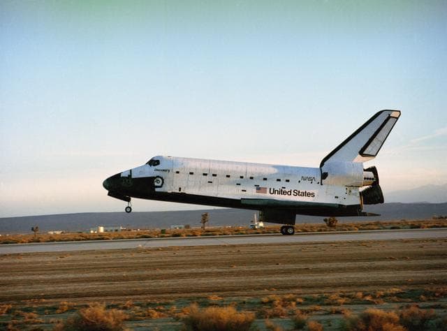 NASA image: STS-33 Discovery, OV-103, MLG touches down on concrete runway 04 at EAFB