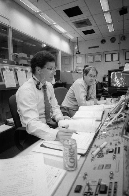 NASA image: Flight directors Castle & Dittemore monitor displays in MCC during STS-34