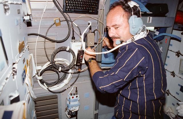 NASA image: STS-35 Mission Specialist (MS) Lounge uses SAREX on OV-102's middeck