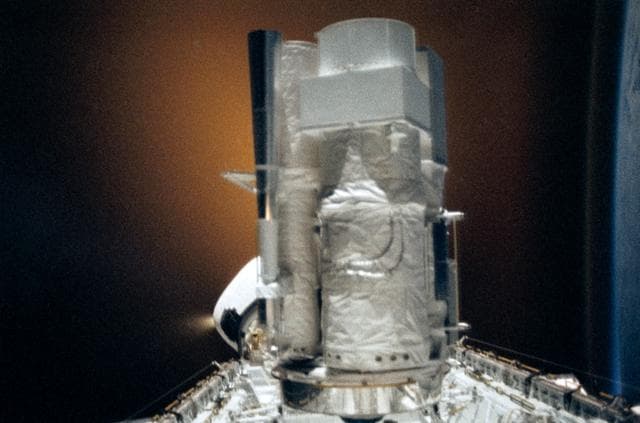 NASA image: STS-35 ASTRO-1 in OV-102's payload bay silhouetted against RCS firing