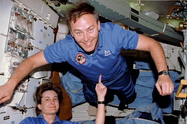 NASA image: STS-37 MS Godwin balances MS Ross using her index finger on OV-104's middeck