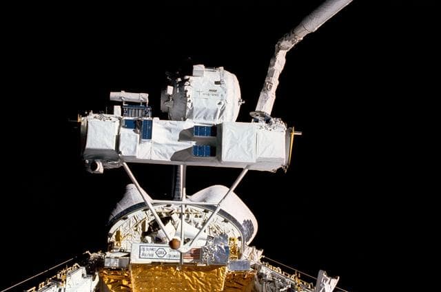 NASA image: STS-39 SPAS-II IBSS is grappled by RMS over OV-103's payload bay (PLB)