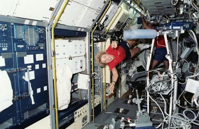 NASA image: STS-40 Payload Specialist Hughes-Fulford "flies" through SLS-1 module