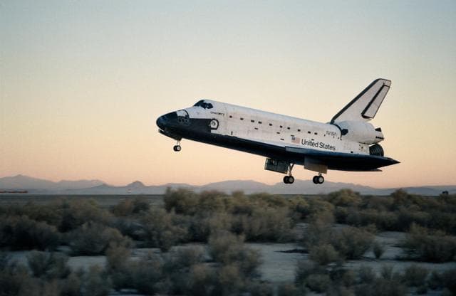 NASA image: STS-41 Discovery, OV-103, glides over concrete runway 22 at EAFB, California