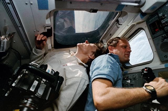 NASA image: STS-42 crewmembers take a look at the Earth from OV-103's aft flight deck