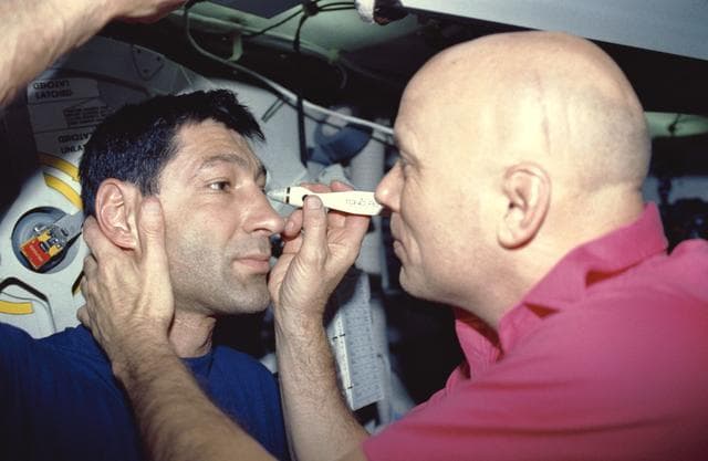 NASA image: STS-44 crewmembers conduct DSO 472, Intraocular Pressure, on OV-104's middeck