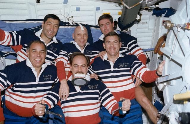 NASA image: STS-44 onboard (in-space) crew portrait features "Trash Man" Hennen