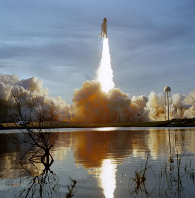 NASA image: STS-48 Discovery, OV-103, soars into the evening sky after KSC liftoff