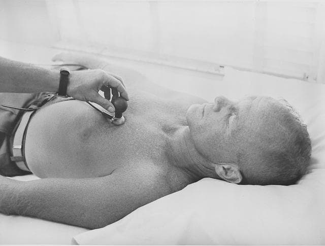 NASA image: Astronaut John Glenn has biosensor attached to body during training