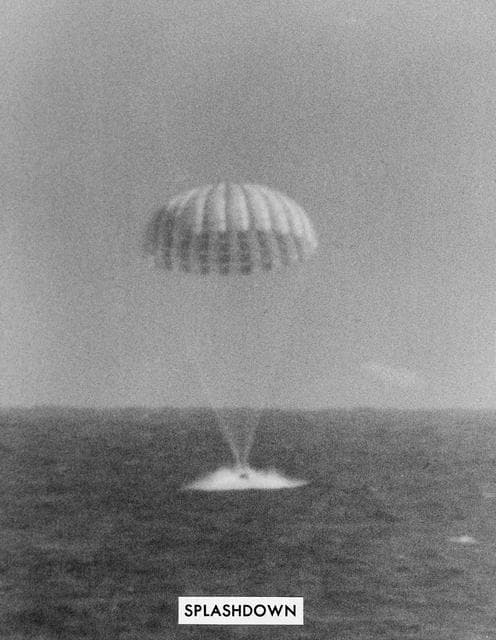 NASA image: Landing of Mercury-Atlas 8 spacecraft with parachute extended 
