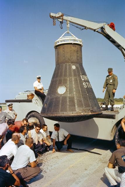 NASA image: DOD Recovery personnel and NASA technicians inspect Friendship 7 spacecraft
