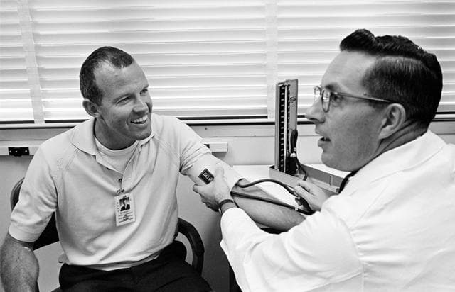 Astronaut Gordon Cooper receives preflight medical exam for Gemini 5 flight