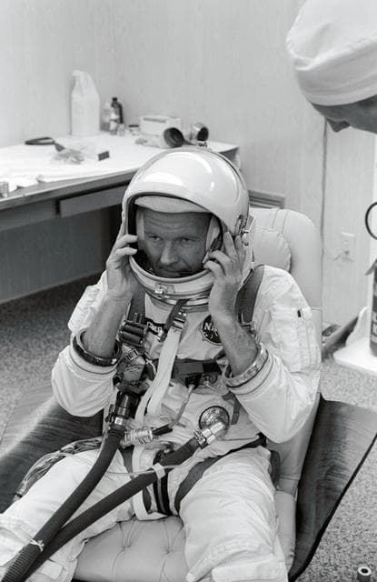 NASA image: GEMINI-TITAN (GT)-5 - TRAINING - SUITING-UP (ADJUSTS HELMET) - CAPE