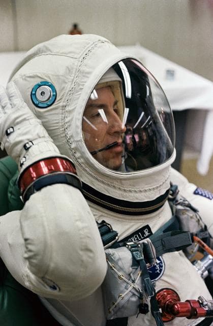 NASA image: ASTRONAUT JAMES A. LOVELL, JR.  - SUIT - SUITING-UP (GEMINI-TITAN [GT]-7) - PILOT (HEAD SHOT W/HELMET) - LITEWEIGHT SUIT - CAPE