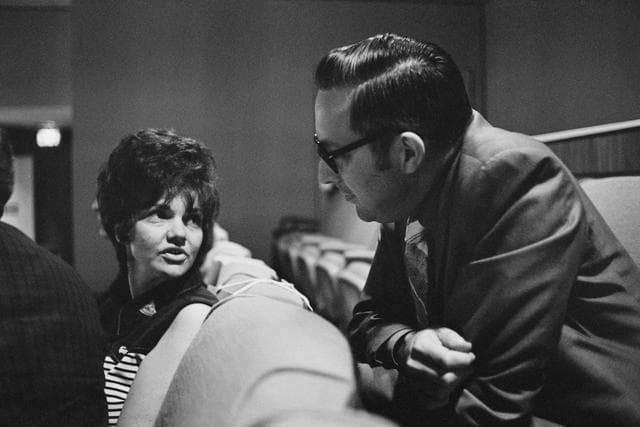 NASA image: Mrs. Lovell in viewing room overlooking FCR
