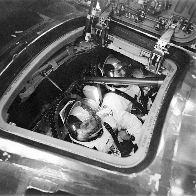 NASA image: Apollo 15 crewmen inside Apollo 15 Command Module during simulation
