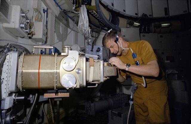 NASA image: Astronaut Paul Weitz works with UV Stellar Astronomy Experiment