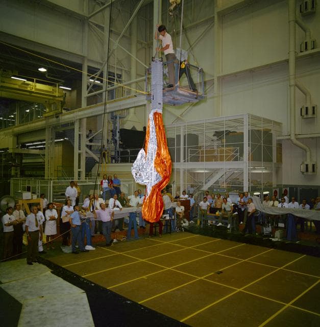 NASA image: "Parasol", sunshade for Skylab 1, receives checkout in bldg 10