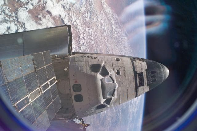 NASA image: Space Shuttle Atlantis as seen from Mir space station during STS-76 mission